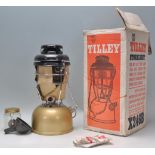 A new and unused Vintage Tilley lamp and accessories in gold enamel colourway being complete with