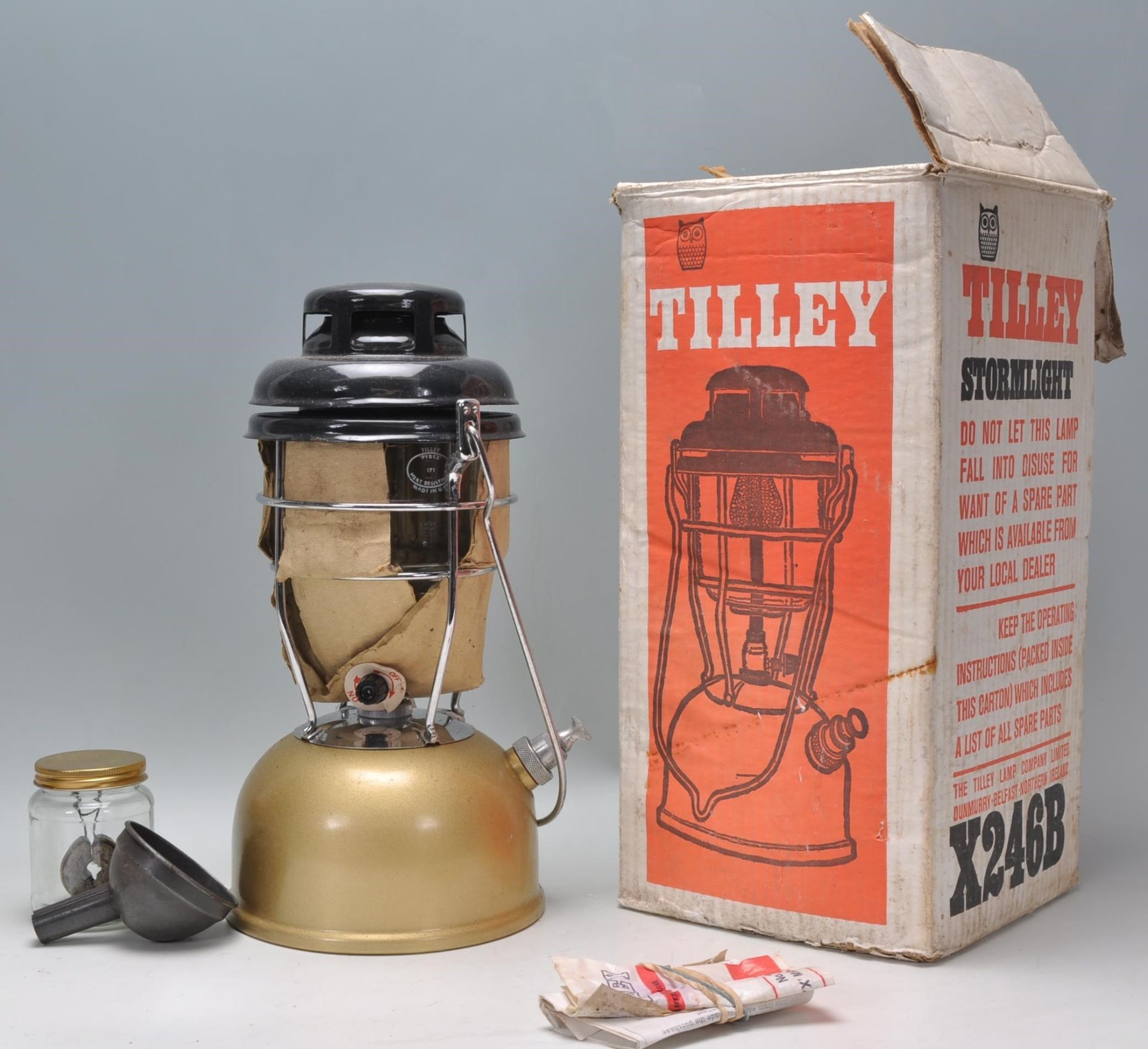 A new and unused Vintage Tilley lamp and accessories in gold enamel colourway being complete with