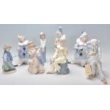 A good collection of seven ceramic clown figurines to include a pair of band members and other