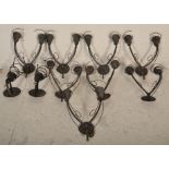 A collection of 8 modern 20th century twin sconce wall lights. Each of brushed metal form having