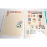 A good collection of block and part sheet stamps along with coinage and notes across two albums from