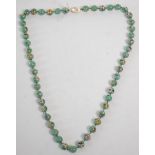 A vintage Chinese Cloisonne beaded necklace having round beads with a mint green ground with