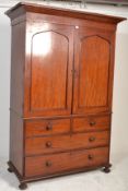 A Victorian 19th century mahogany Linen press with a moulded cornice over two panelled doors