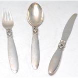 A Georg Jensen silver Cactus pattern three piece christening set comprising knife, fork and a