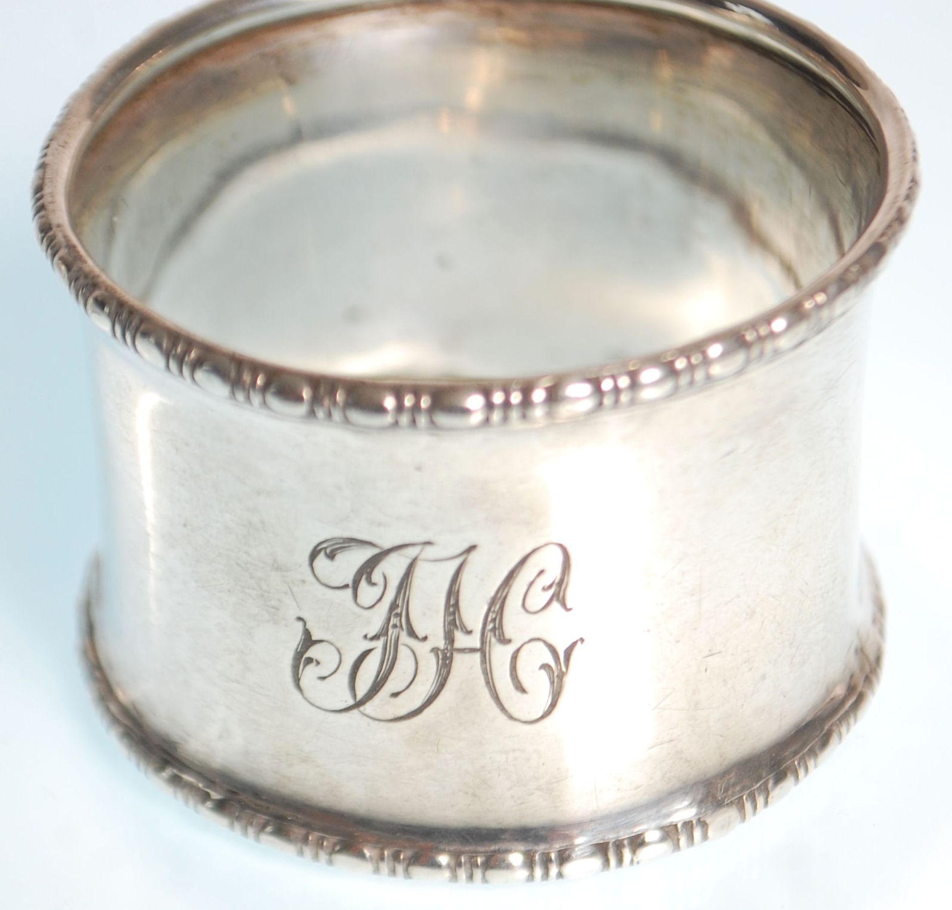 Two silver hallmarked napkin rings to include one with gadrooned borders and engraved initials to - Image 5 of 6