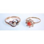 A 9ct gold hallmarked coral and diamond cluster ring. The central cabochon coral with halo of