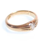 A stamped 18ct gold ring claw set with a central oval cut diamond. Diamond estimated at around