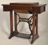 A Victorian 19th century cast iron and oak Singer Sewing Machine table. The cast iron painted tredle
