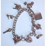 A silver charm bracelet with a heart lock adorned with eight charms including a church, duck, Bible,