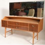 A good vintage retro 20th Century G-Plan light oak dressing table raised on tapering supports with