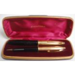 A 20th Century two piece Sheaffer writing set consisting of fountain pen having a 14k gold nib and a