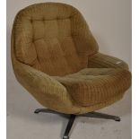 A retro mid century swivel egg chair  having a 4 point swivel base with cream upholstered armchair