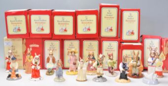 A collection of fourteen Royal Doulton bunnykins ceramic figurines to include a judge, an angel, a