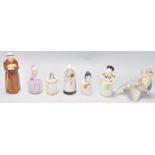 A group of six Royal Worcester porcelain candle snuffers to include a monk, a nun, a Chinese figure,