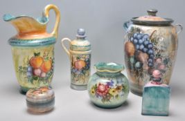 A mixed group of six Pavlidis Ceramics wares each piece hand painted with fruit patterns and being