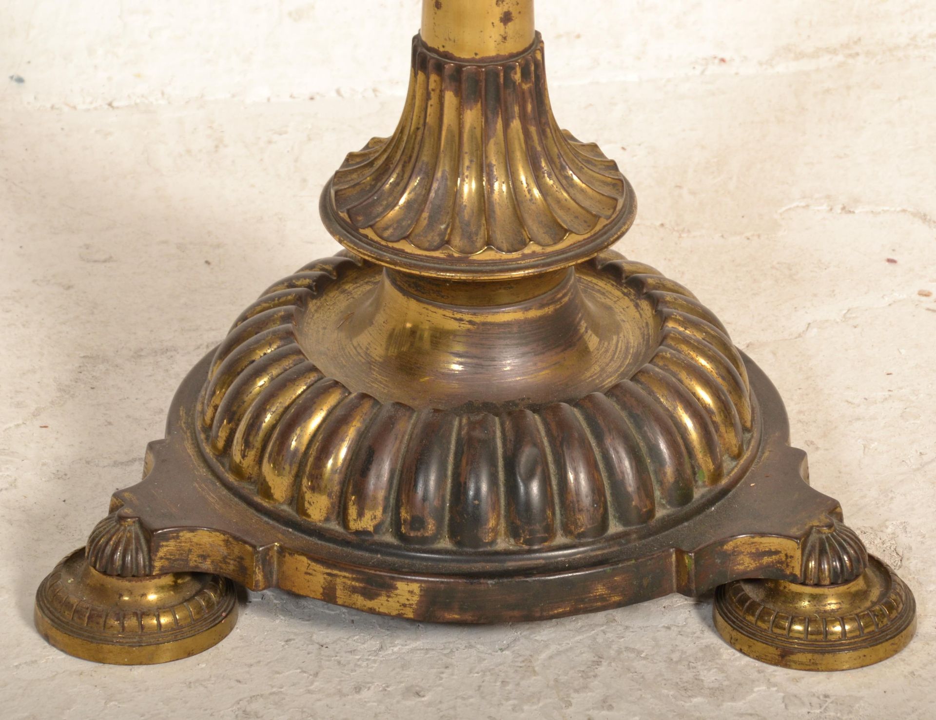 A 19th Century Victorian free standing oil lamp raised on a round base with three shell formed feet, - Image 2 of 4