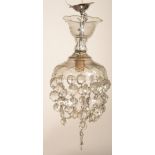 An early 20th Century Edwardian cut glass ceiling light shade with cut glass droplets.