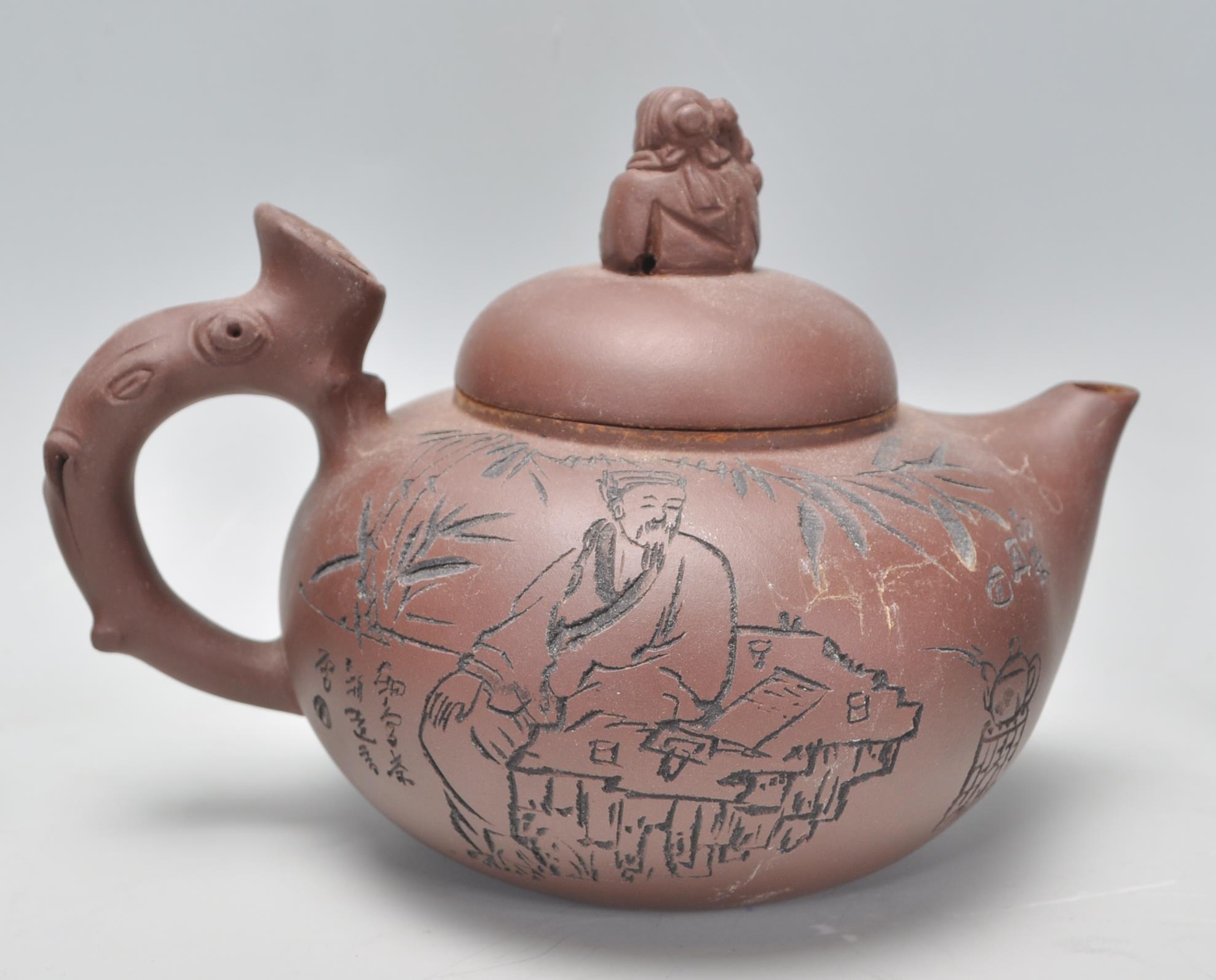 A Chinese Yixing clay teapot having carved decoration of a seated male figure with character marks - Image 3 of 13