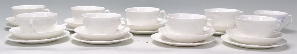 A vintage Wedgwood bone china countryware china tea service consisting of tea cups in the form of