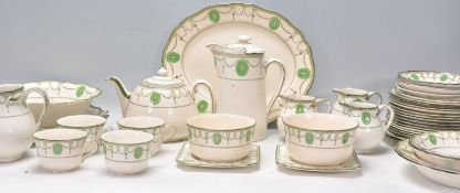 An early 20th Century Royal Doulton Countess pattern ceramic tea  / dinner service having green