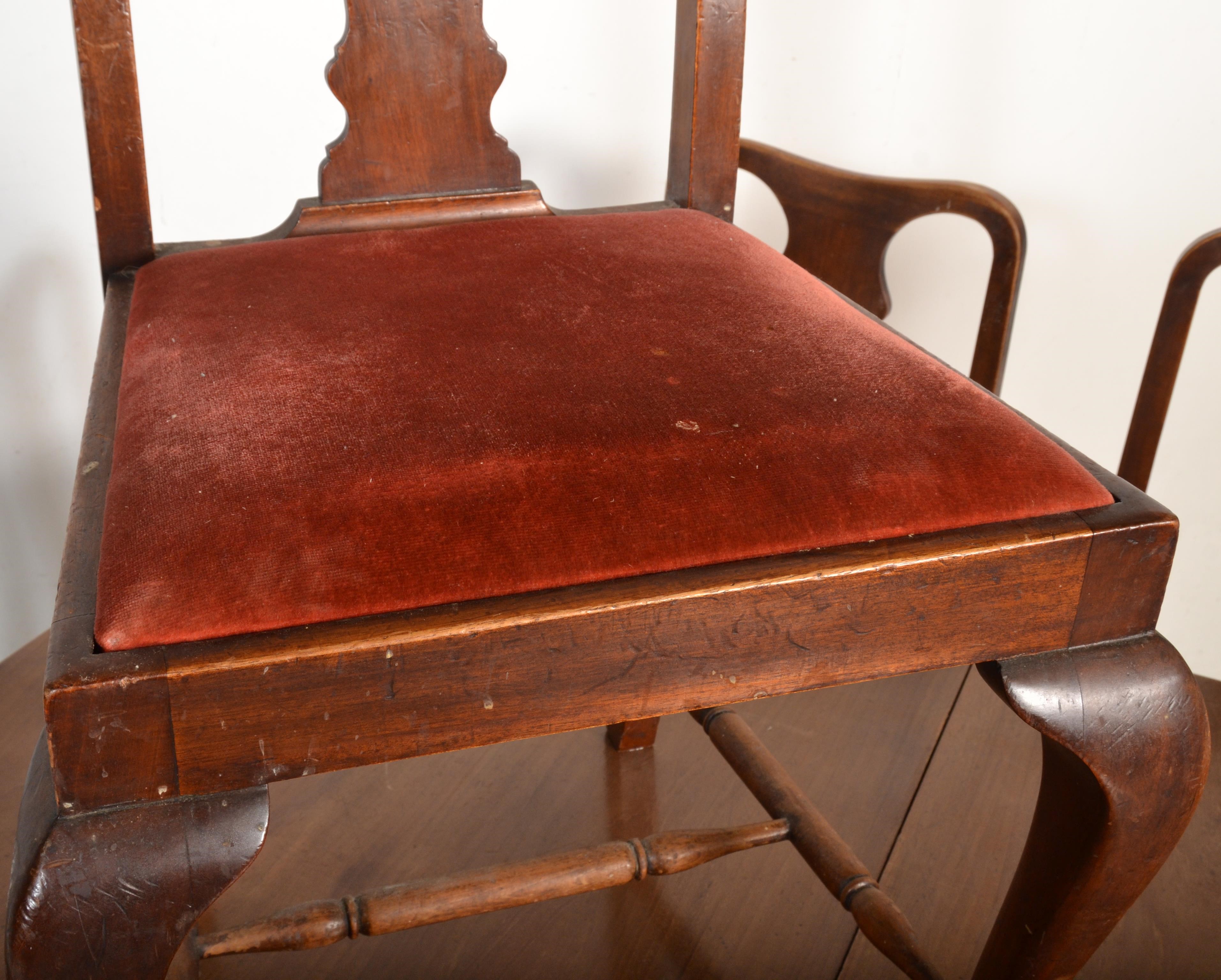 A 1920s mahogany extending dining table with cabriole legs along with 6