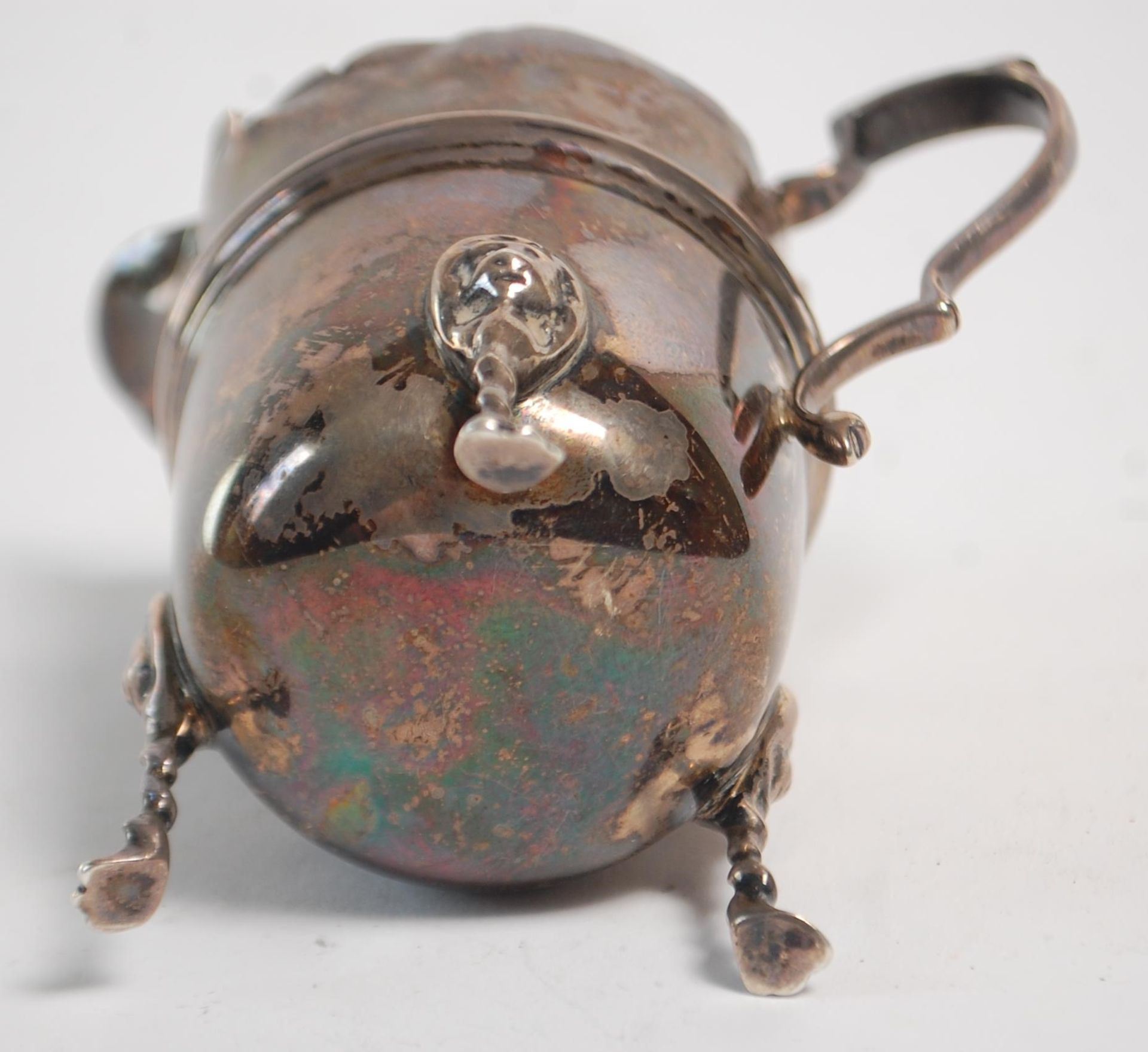 An early 20th Century silver hallmarked creamer jug having a flared top with banded center raised on - Image 7 of 9