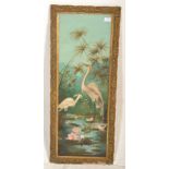 An vintage early / mid 20th century Japanese reverse painted glass panel depicting cranes within a