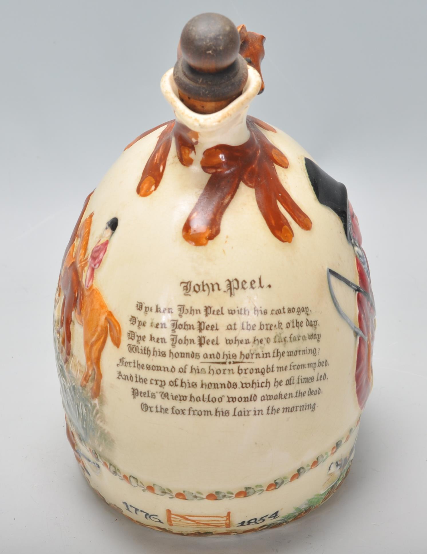 An early 20th Century Crown Devon ceramic John Peel musical flagon flask / decanter having a moulded - Image 2 of 8