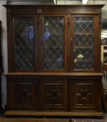 A large and impressive oak and leaded glass librar