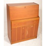 A mid century Danish teak wood bureau desk. Raised on plinth base with a fall front bureau having