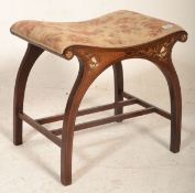 A Victorian 19th century rosewood and marquetry inlaid piano / dressing table stool raised on
