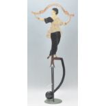 A vintage 20th Century balance character in the form of a lady dancing. The balance of iron