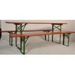 A vintage industrial / festival / garden Trestle table and two bench set with painted  pine tops