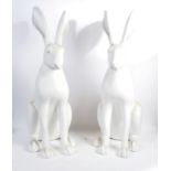 PAIR OF OVERSIZED PROMOTIONAL WHITE RABBIT STATUES