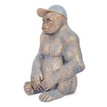 20TH CENTURY FIBREGLASS STATE OF A GORILLA WITH CAP