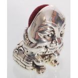 A sterling silver "humpty dumpty" pincushion havin