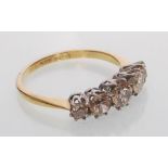 An 18ct yellow gold five stone diamond ring set wi