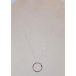 A 18ct white gold & diamond pendant of circular de