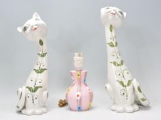 A pair of vintage retro Italian cat figurines of e