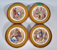 A collection of wooden framed pot lid type porcela