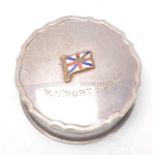 A silver hallmarked lidded pot with enamel flag an