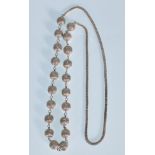 A 20th Century silver necklace having spaced filig