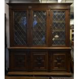 A large and impressive oak and leaded glass librar