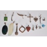 A selection of silver pendant and charms to includ