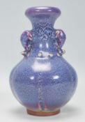 A Chinese earthenware / Jun ware style vase having