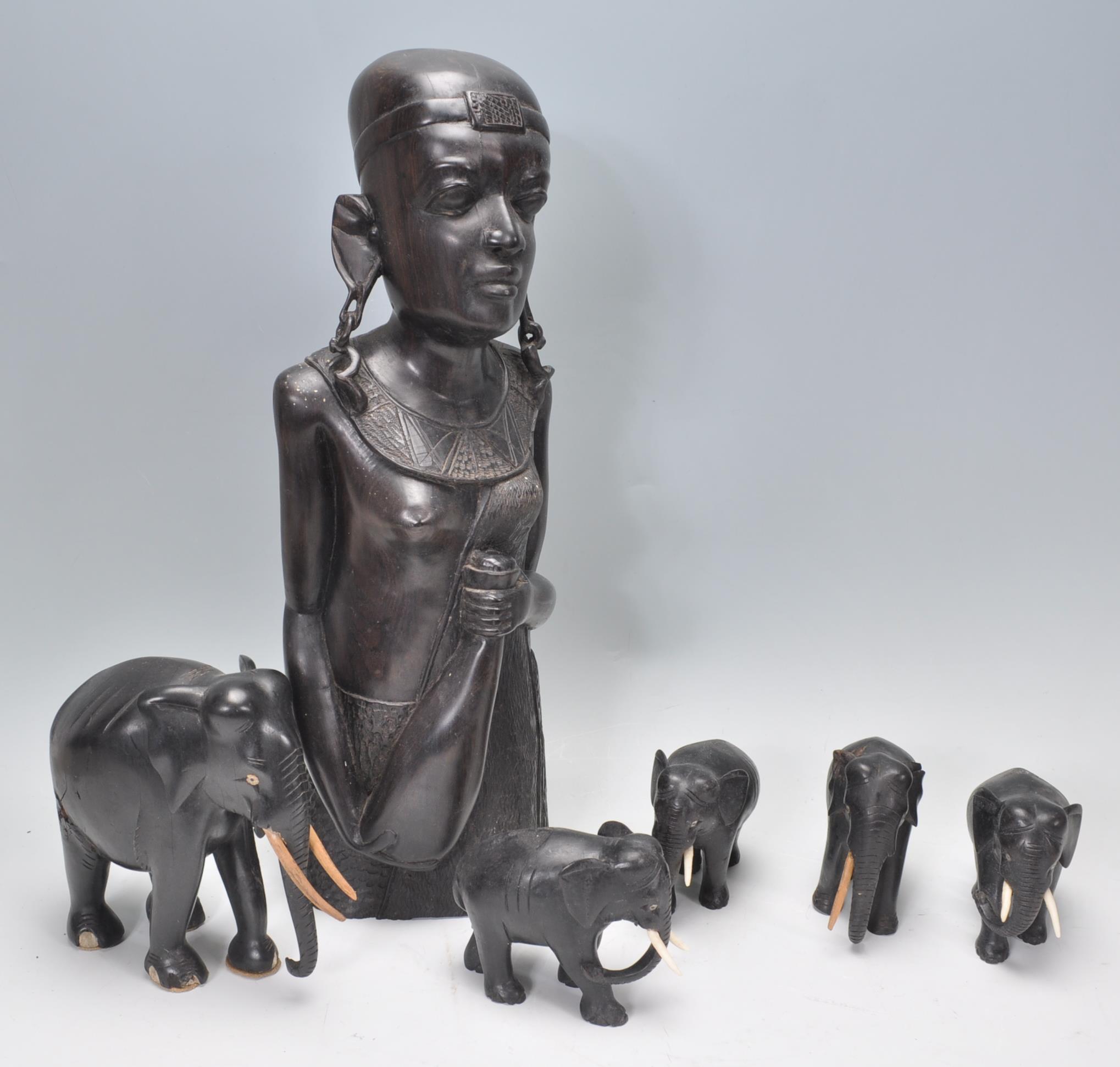 An African tribal carved ebony wood sculpture of a