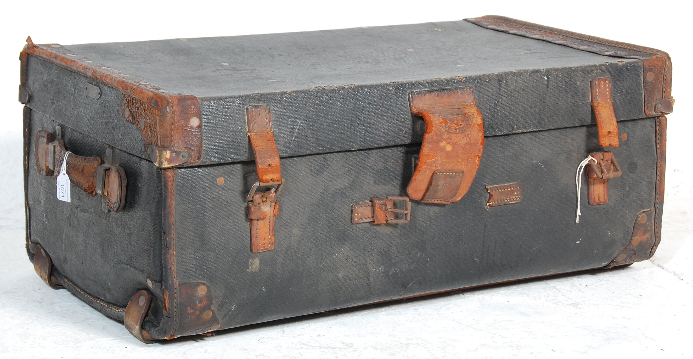 A good vintage 20th leather travel trunk case having brown leather handles and straps. The cover