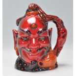 A Royal Doulton flambe ceramic character jug in the form of Aladdin's Genie. No. D6971, limited