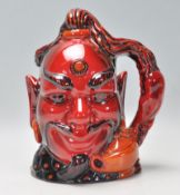 A Royal Doulton flambe ceramic character jug in the form of Aladdin's Genie. No. D6971, limited