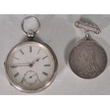 A 19th Century Victorian silver pocket watch having a white enamelled face with subsidiary dial